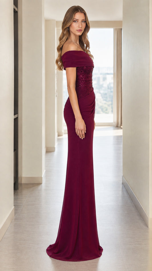 Side profile of burgundy formal evening gown with ruched side detail