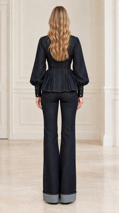 Back view of model wearing Dark Indigo denim set highlighting gathered waist and flared hems