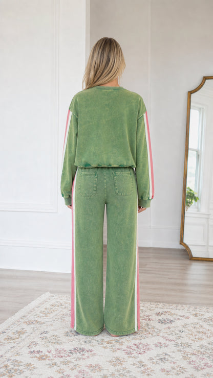 Back view of model wearing the Sage Green wide-leg lounge pants and pullover sweatshirt set
