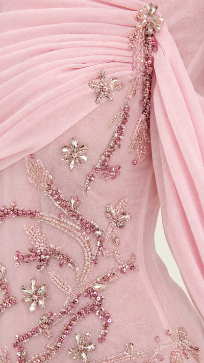 Close-up detail of blush pink draped chiffon bodice and intricate floral beading