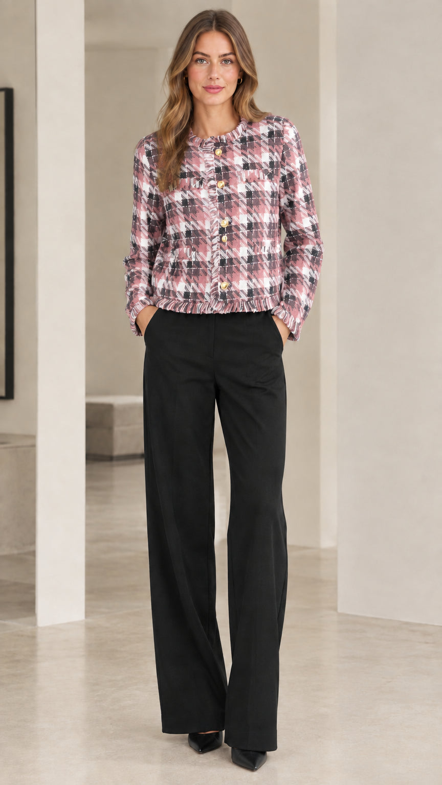 Model wearing pastel pink and white plaid tweed cropped jacket