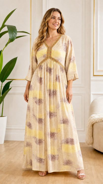 Front view of model wearing Beige and yellow abstract print casual maxi dress